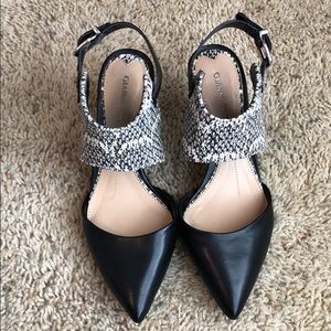 Snake skin and black pumps
